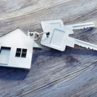 Keys attached to a house keychain Keys attached to a house keychain