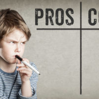 Pondering Pros and Cons, Boy on grunge background Pondering Pros and Cons, Boy on grunge background
