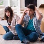 Young couple receiving foreclosure notice letter Young couple receiving foreclosure notice letter