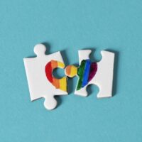 puzzle pieces which form a rainbow heart