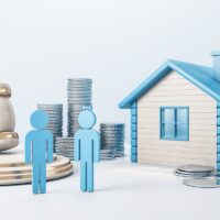 Blue house with golden coin stacks, male, female and gavel on concrete background. Divorce and property division concept. 3D Rendering. Blue house with golden coin stacks, male, female and gavel on concrete background. Divorce and property division concept. 3D Rendering.